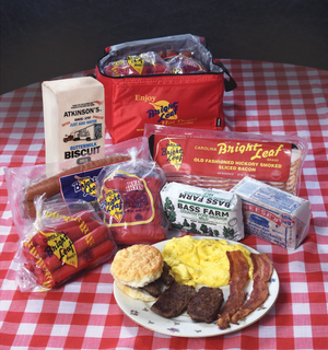 The North Carolina Iconic Brands Sampler (1-Hot Dog, 1-Red Hot, 1-Bacon, 1- Loop Smoked Sausage, 1-Bass Farm, 1-Neeses, 1-Biscuit Mix)